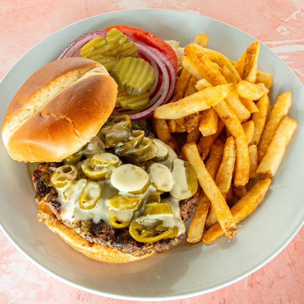 Redbone's Grill & Bar's burger with melted cheese, jalapeños, and a side of golden fries.